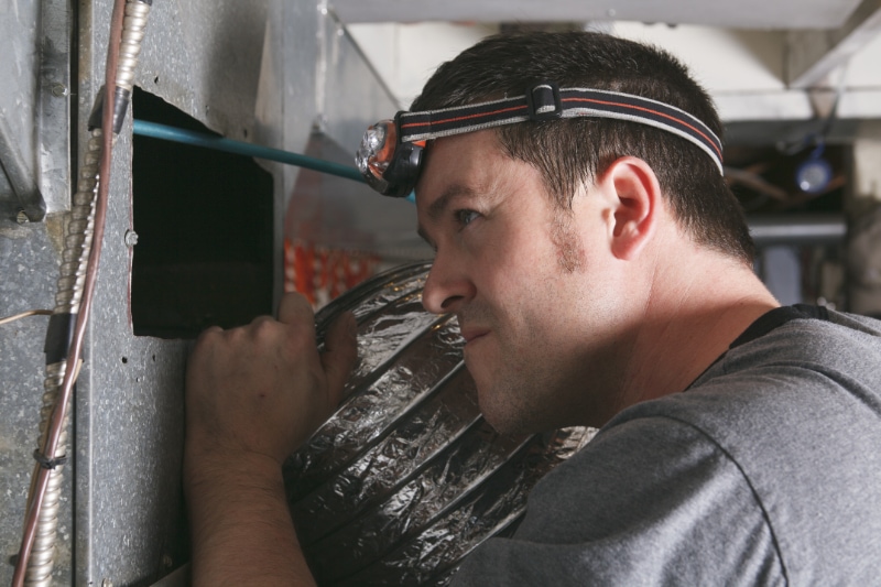 Why Is My Furnace Leaking Water? Ventilation Cleaner - Looking for Dust.