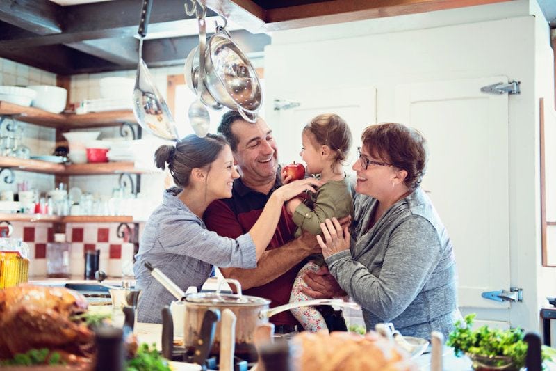 Image of a family in a kitchen. What Do Air Purifiers and Air Filters Do?