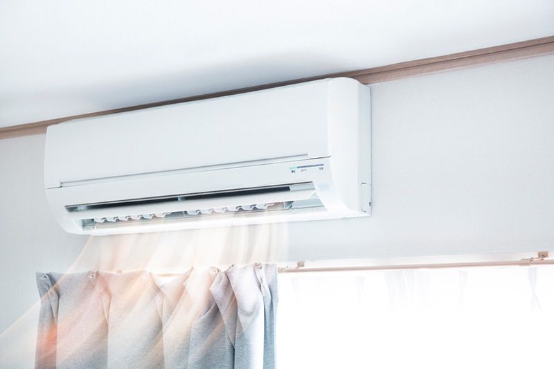 Image of a ductless system blowing air. Why ductless is the way to go.